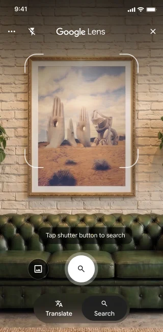 On a phone, the Google Lens app is open. A notification indicates that the user can tap the shutter button to search an image of large stone hand sculptures in a desert.